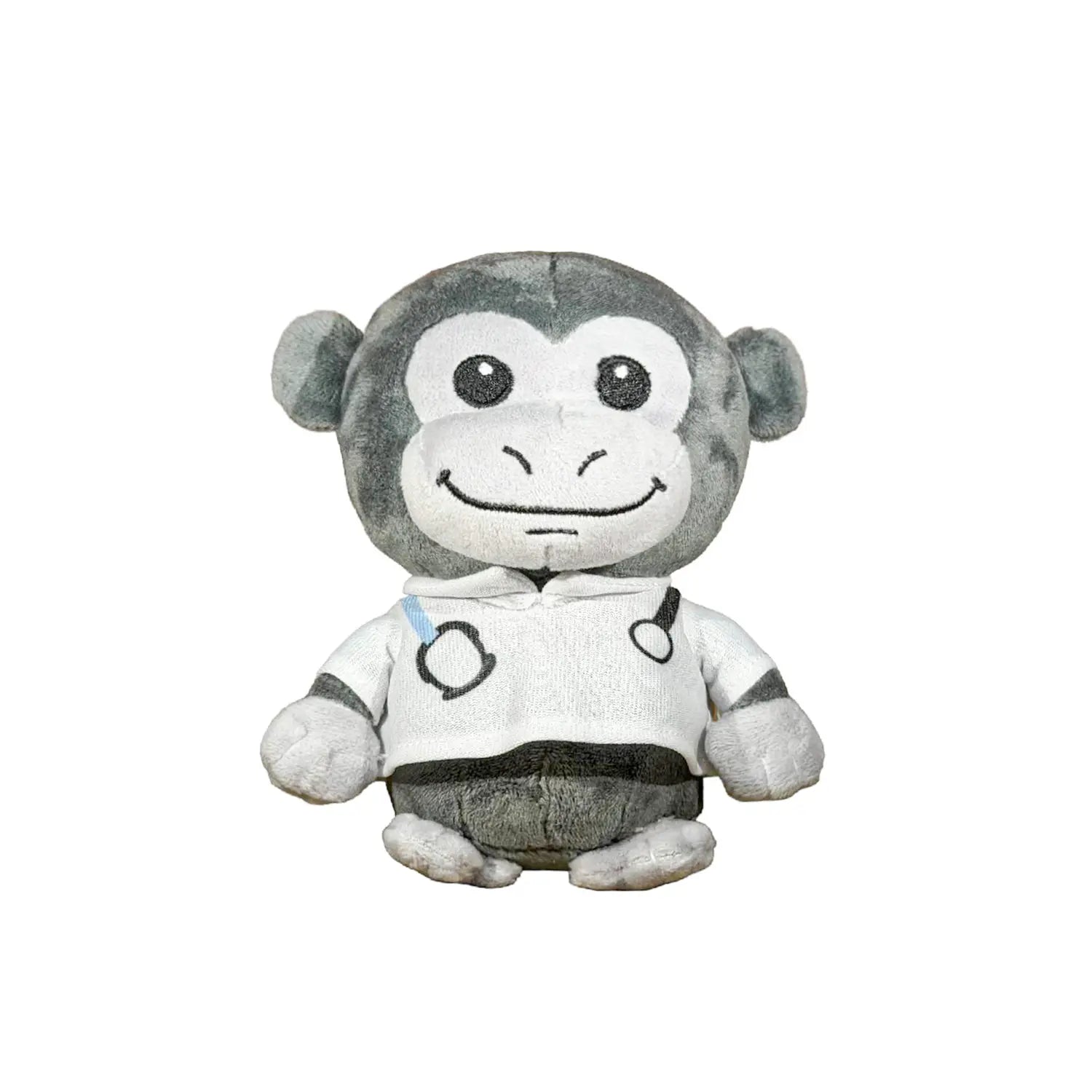 A plush monkey toy wearing a white shirt with black circular graphics and a small blue accent, photographed against a plain white background.