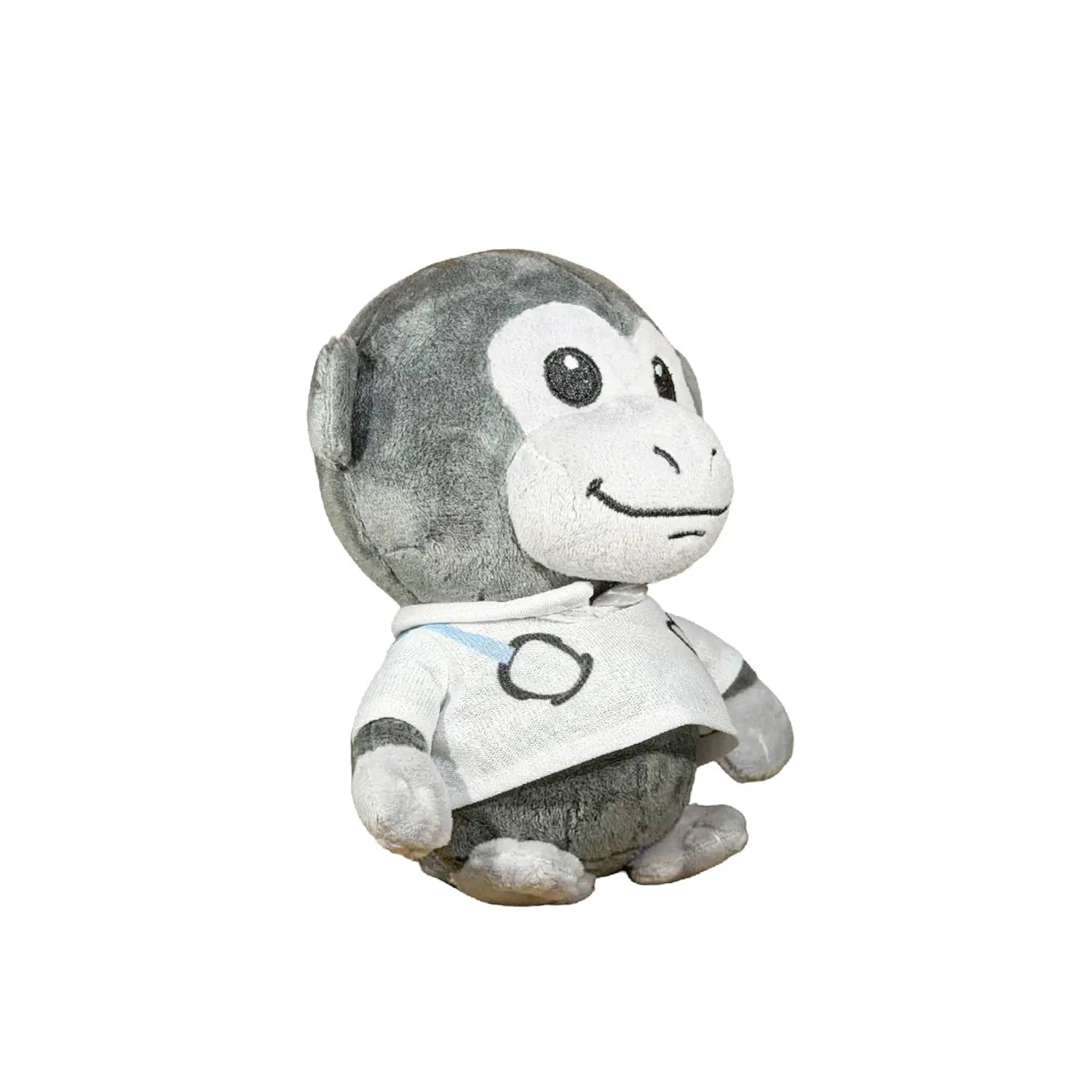 A plush monkey toy wearing a white shirt with black circular graphics and a small blue accent, photographed against a plain white background.