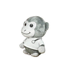 A plush monkey toy wearing a white shirt with black circular graphics and a small blue accent, photographed against a plain white background.